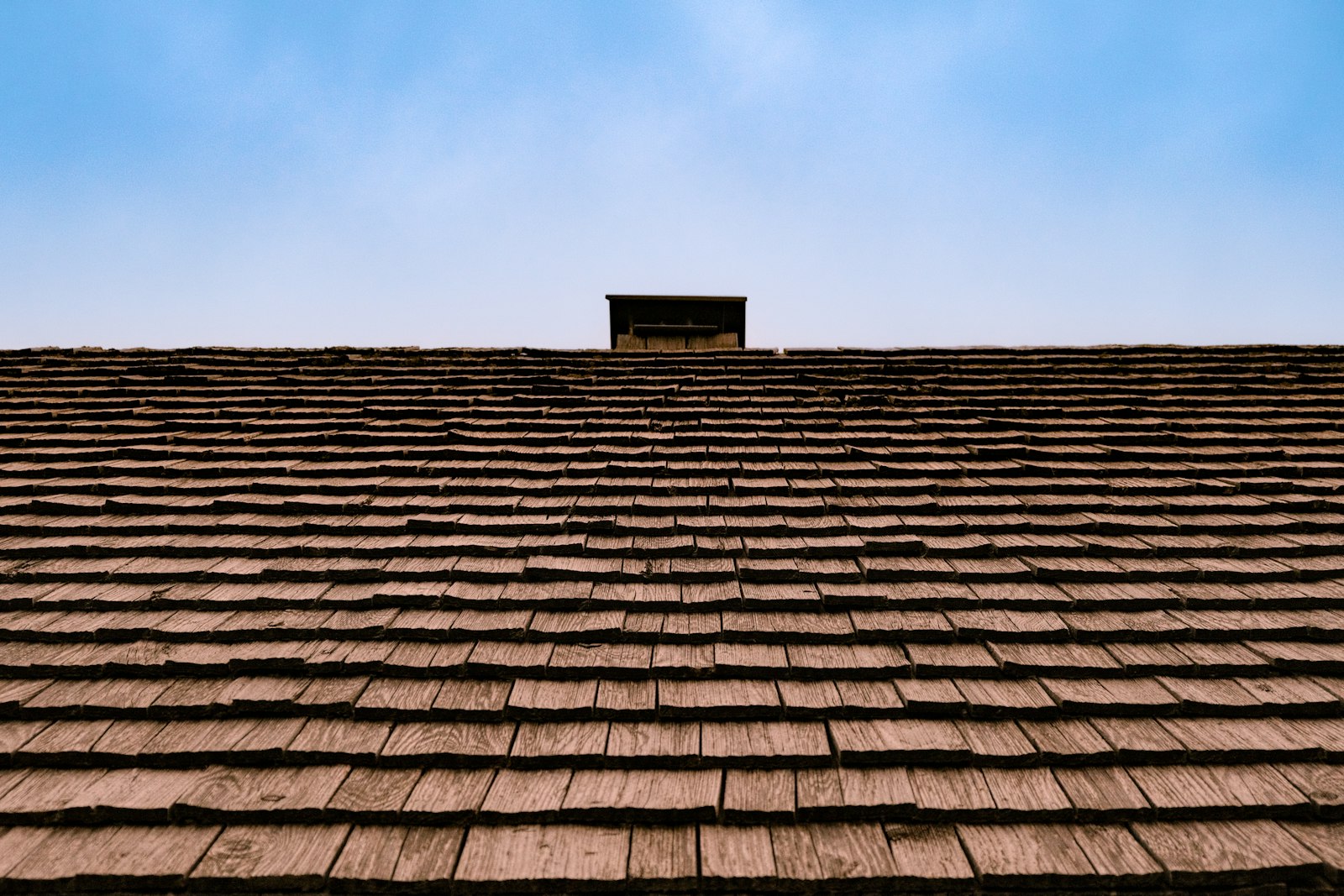 Roofing materials and shingles